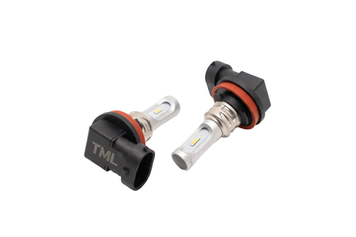 Two car light bulbs with 'TML' branding on a white background